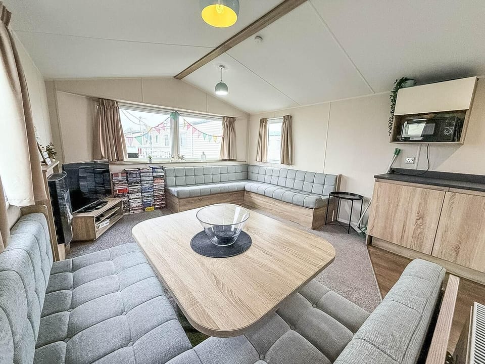The cosy living area is perfect for curling up with a blanket and a good book.