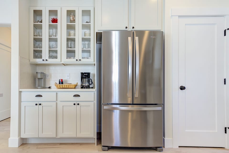 The kitchen has charming glass cupboards