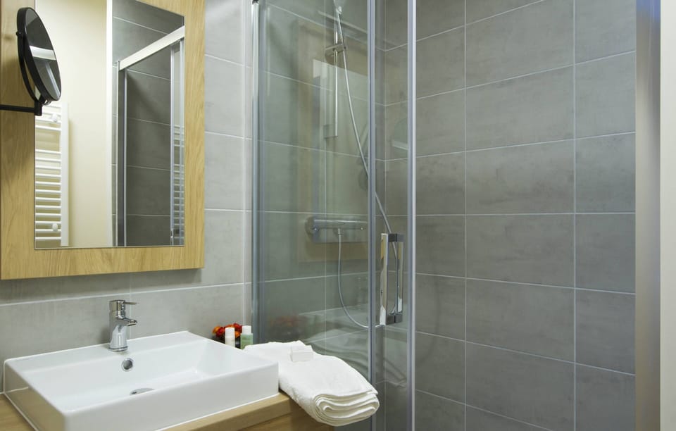 Get ready for your day in the lovely bathroom.