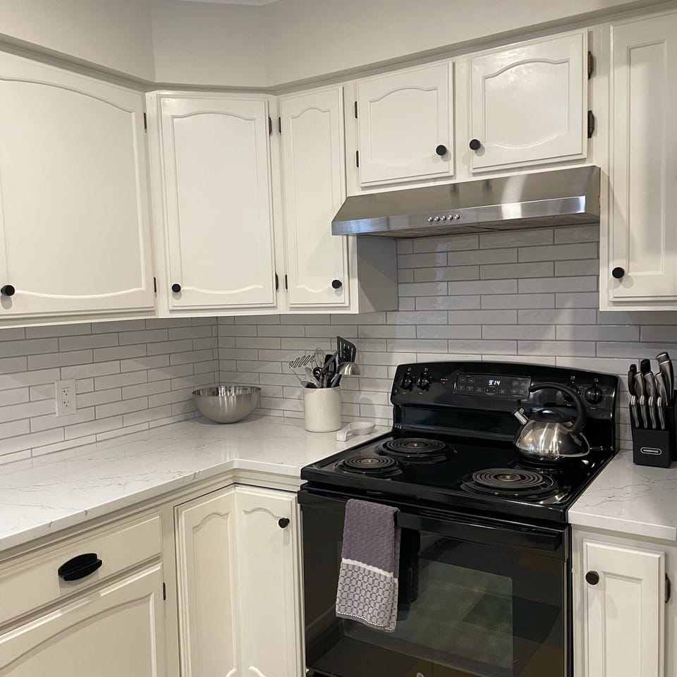 New range and hood vent installed in kitchen