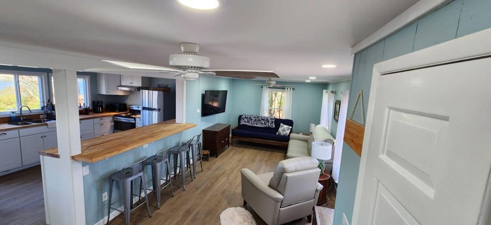 View of the 4 seat bar w/ chopping block counter