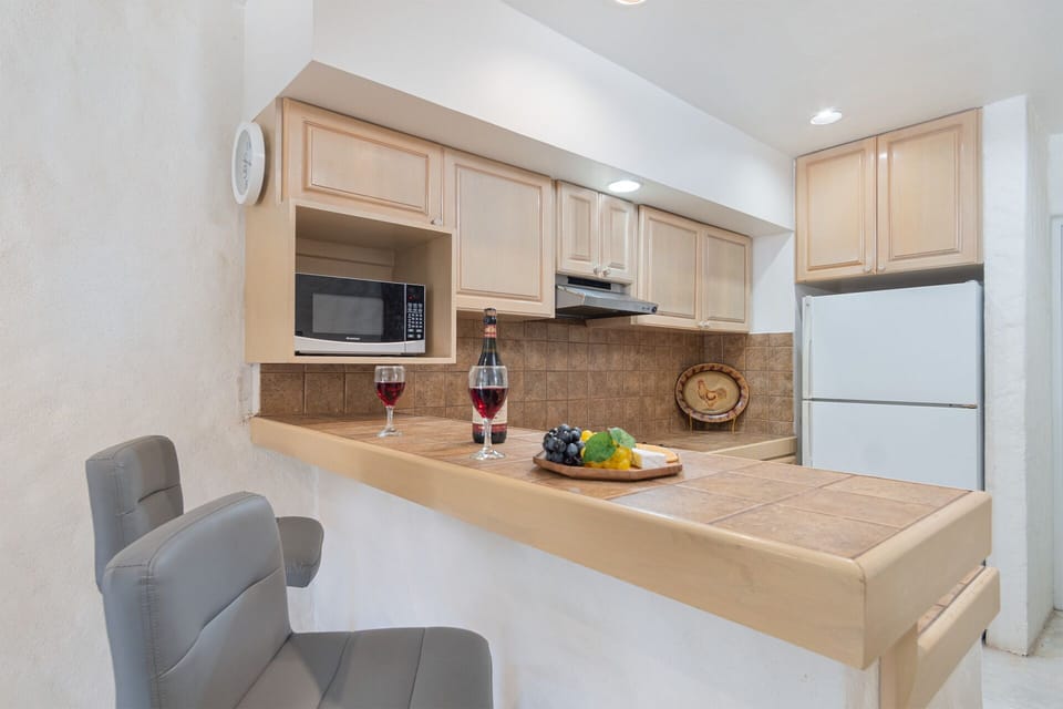 padded bar stools at the kitchen counter