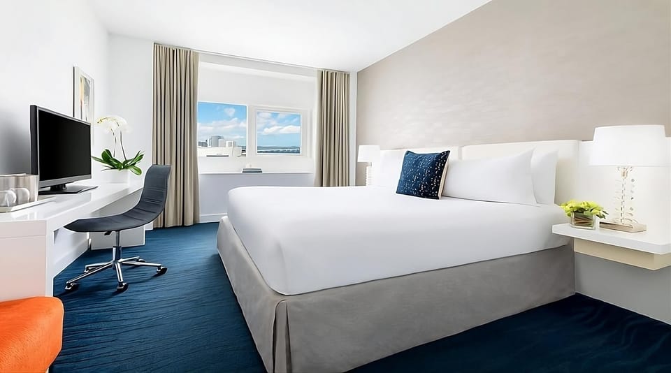 Recharge in a modern king room with dedicated work desk.