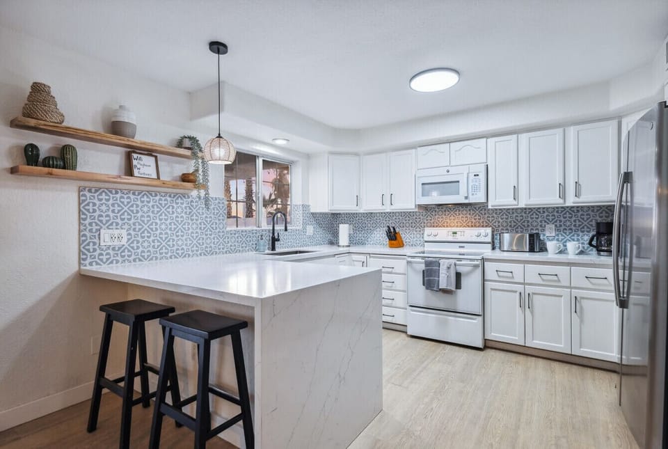 A fully equipped kitchen with plenty of counter space