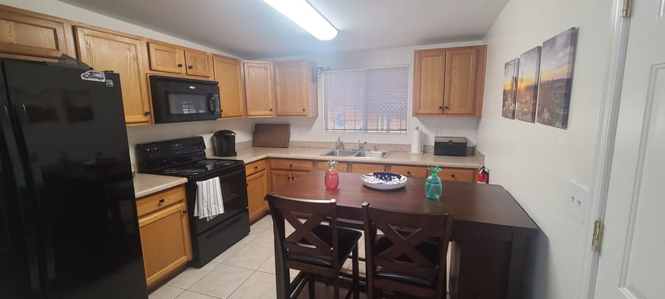 Kitchen table can be moved seat 4, used as an island to entertain or seat 2