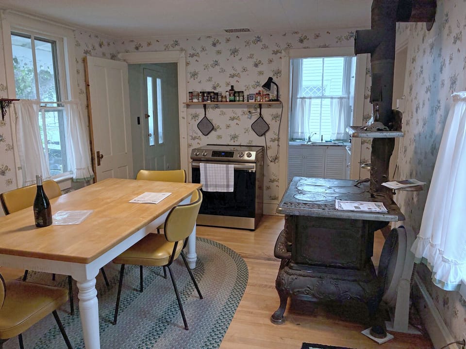 Kitchen with view of entry hallway and pantry