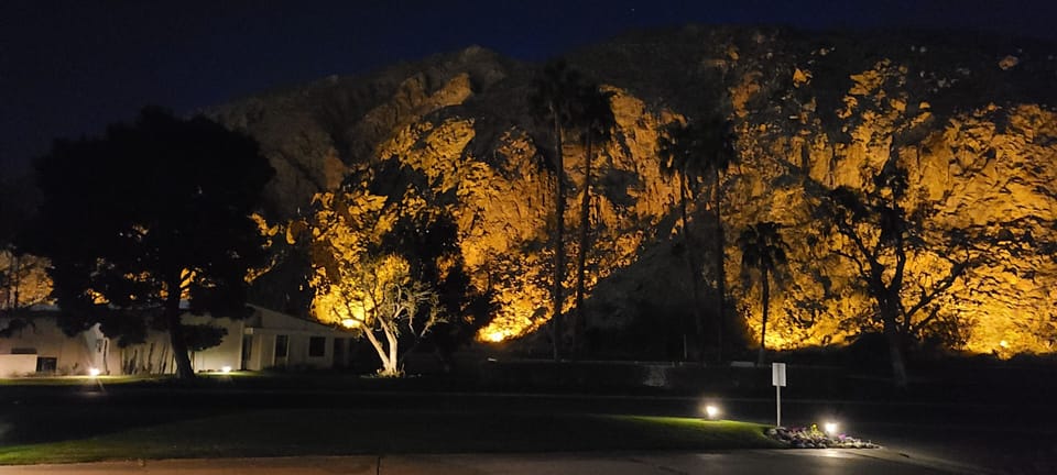 Mountains lit up at night right outside your door