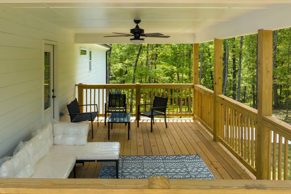 Cool breezes and the sounds of nature are always on tap on this deck attached to the master bedroom.