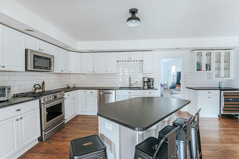 Fully stocked kitchen with bar seating