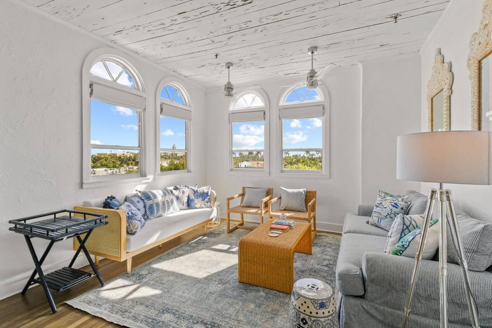 Spacious Living Area surrounded by windows for natural sunlight