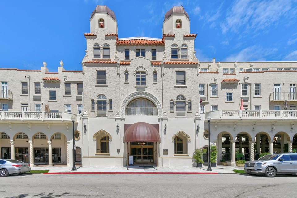 The Palm Beach Hotel is a true Historic Landmark showcasing stunning double bell tower Spanish Baroque architecture that exudes old-world glamour and the charm of a bygone era. Fun fact: Publix is conveniently located just across the street.