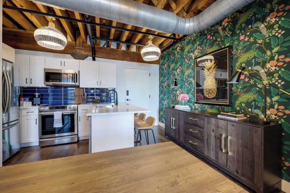 Elevate your cooking experience with a touch of paradise in this vibrant tropical-themed kitchen 🍍🌺 #IslandDreams