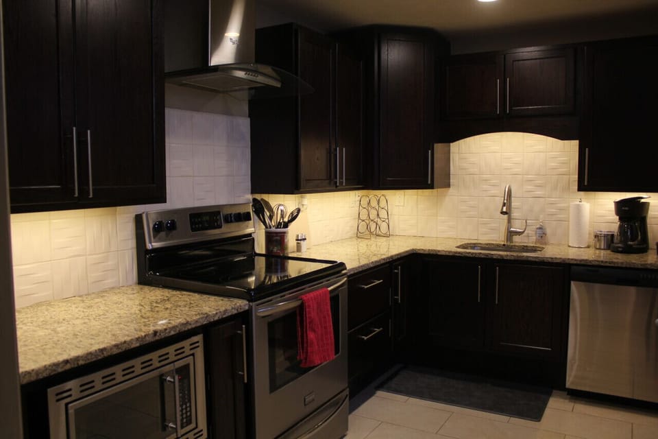 Whether you're a seasoned chef or simply enjoy cooking your favorite meals, our full kitchen with stainless steel appliances is sure to inspire your culinary adventures.