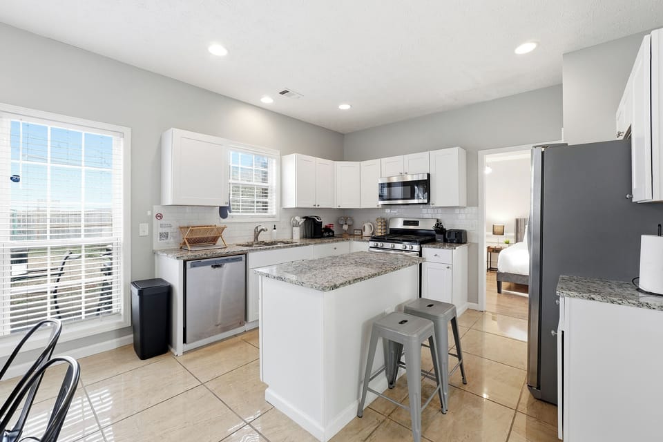 Dining space with natural light and open access to the living room.