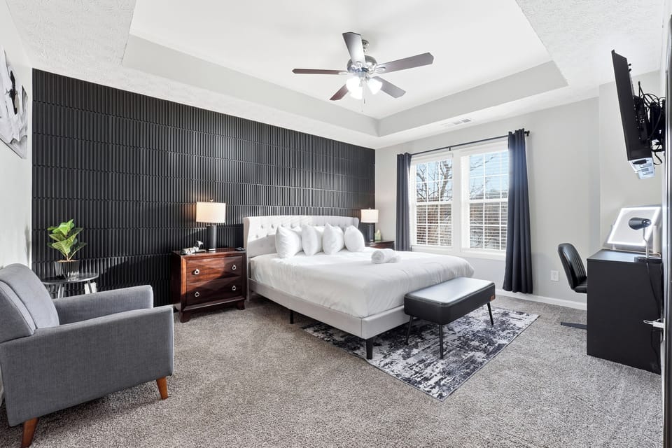 Bright King Suite with blackout curtains and a relaxing seating area.