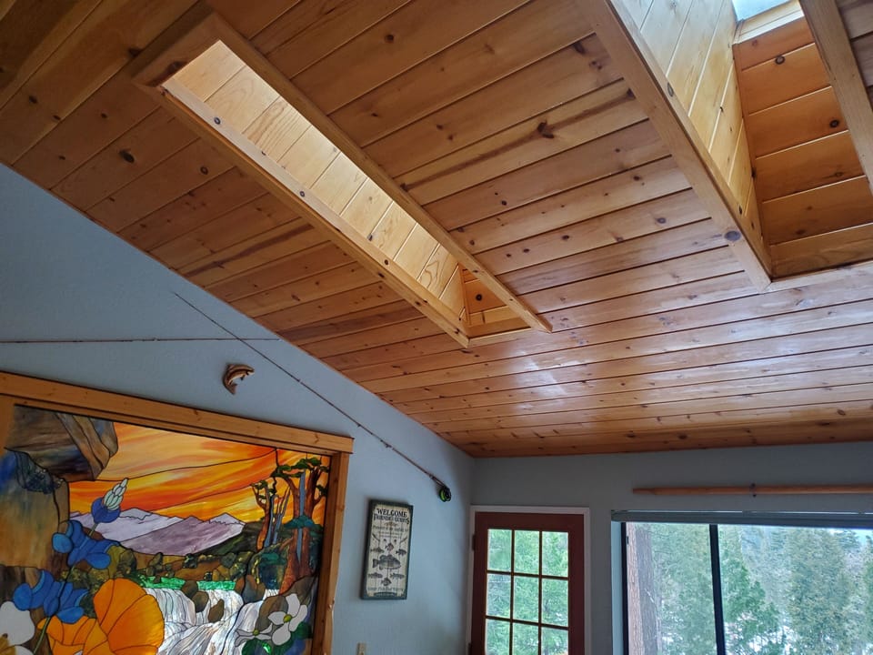 Master bedroom pine ceiling with two sun-roofs. Star gaze while in bed.