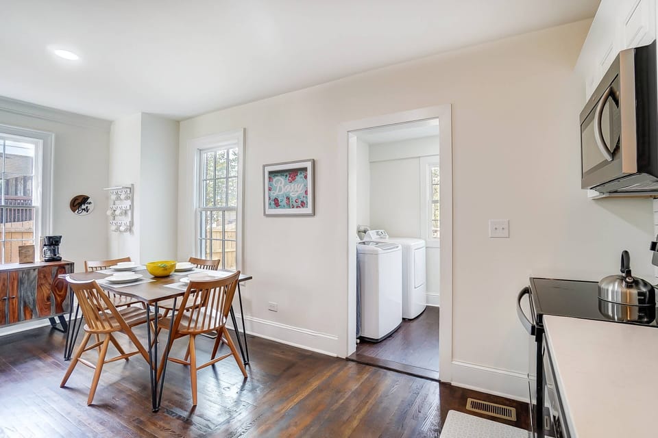 You can access the laundry room from the kitchen/dining room.
