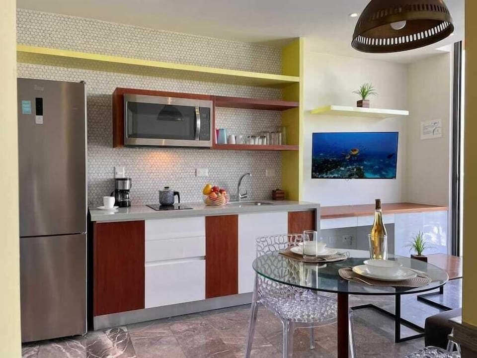 Open kitchen and living area with smart TV