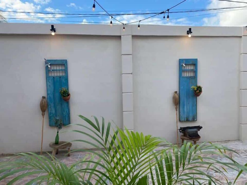 Charming courtyard with blue doors and plants