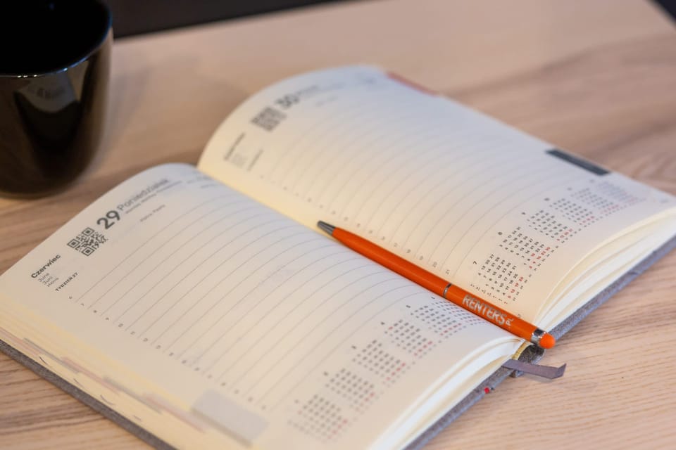 A close-up shot of an open notebook, emphasizing a workspace detail.