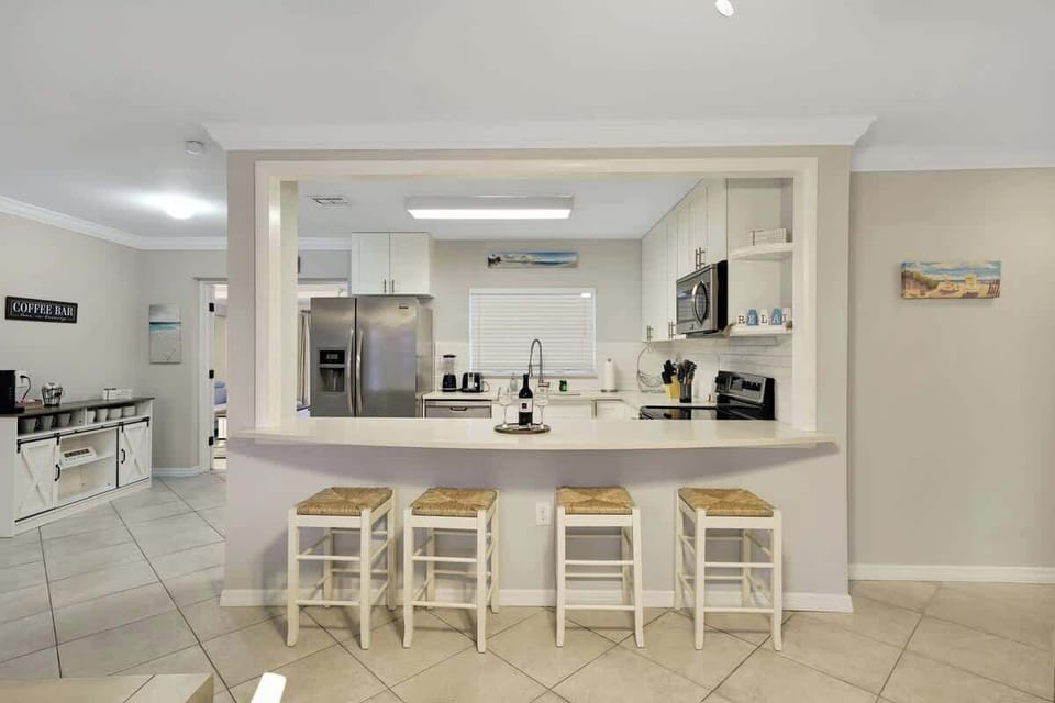 The kitchen bar has 4 stools where you can enjoy the complimentary wine. 