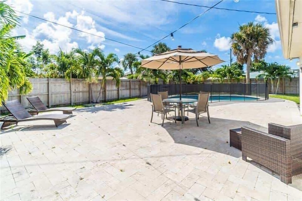 Lounge here right by the pool! Enjoy dining out in our 4 seater outdoor dining table with big umbrella or relax in one of these 2 lounge chairs by the pool! 