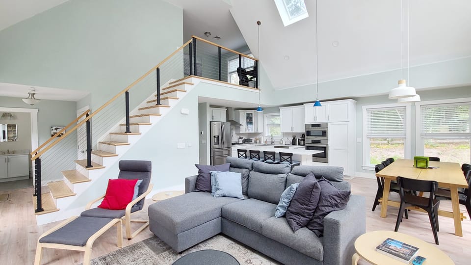 Living room with dining area and kitchen beyond