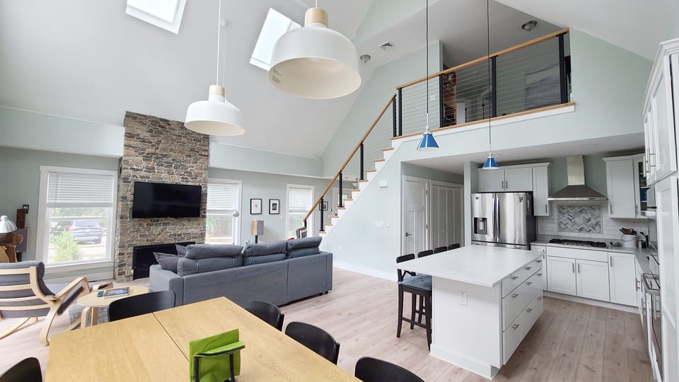 Dining area with the kitchen and living room beyond