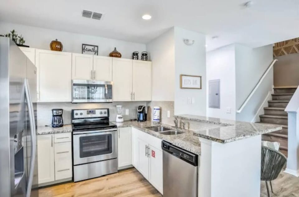 This open concept kitchen is a perfect area for a meal prep while spending a great time with your family and friends.