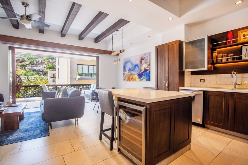 The gourmet kitchen includes a wine fridge