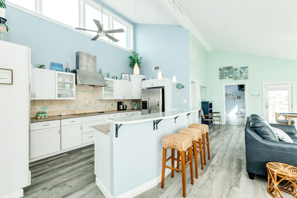 Grab a snack or watch the family chef work at the breakfast bar seating 3
