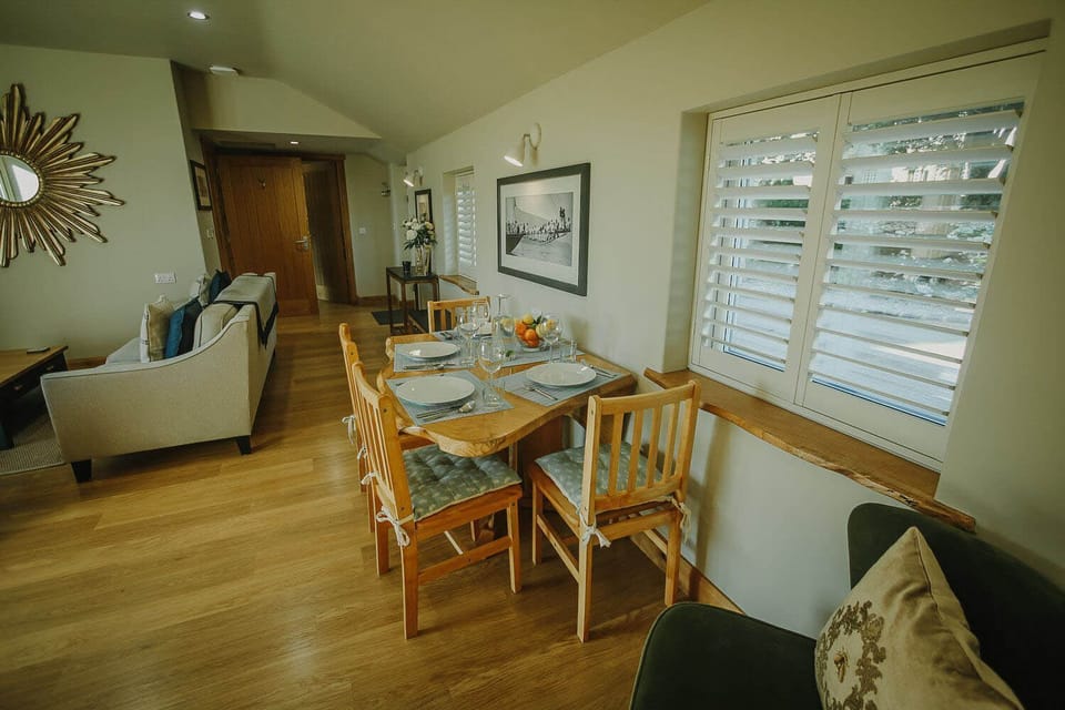 Dining area in the open plan living space with 4 dining chairs