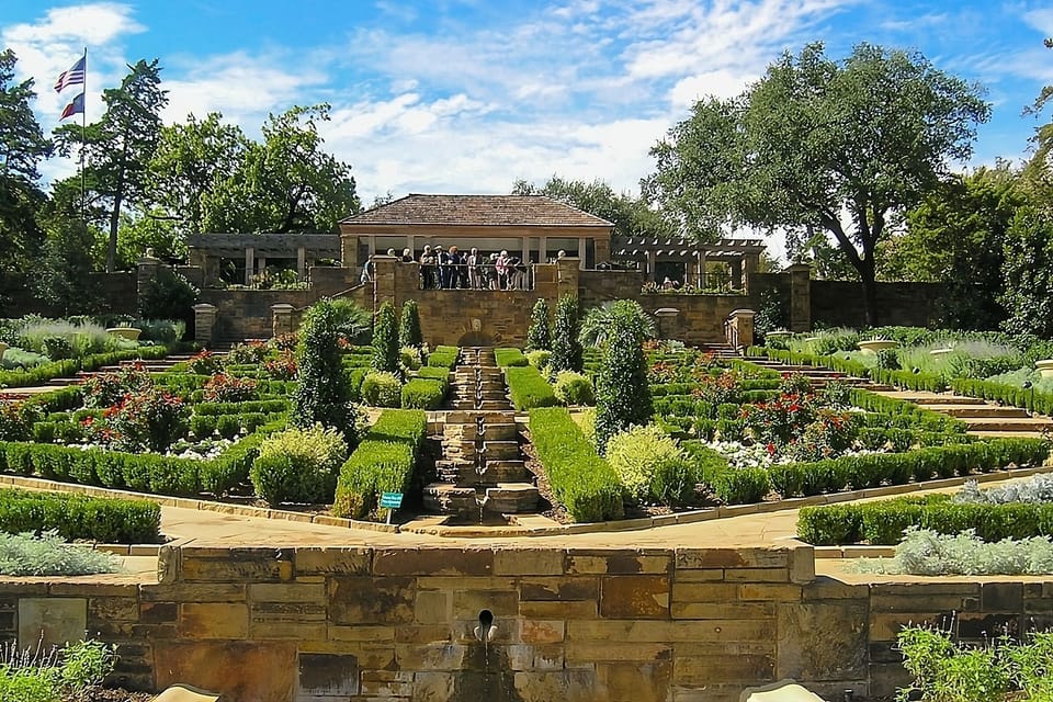 Stroll through lush gardens and soak up sunny afternoon calm.
