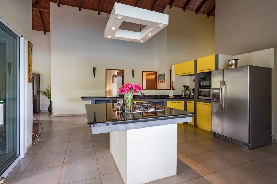 Patio doors on all sides to create beautiful breezes through the villa. 