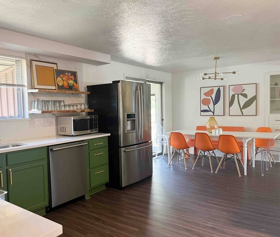 Kitchen and living room are open to dining room with seating for 8. 