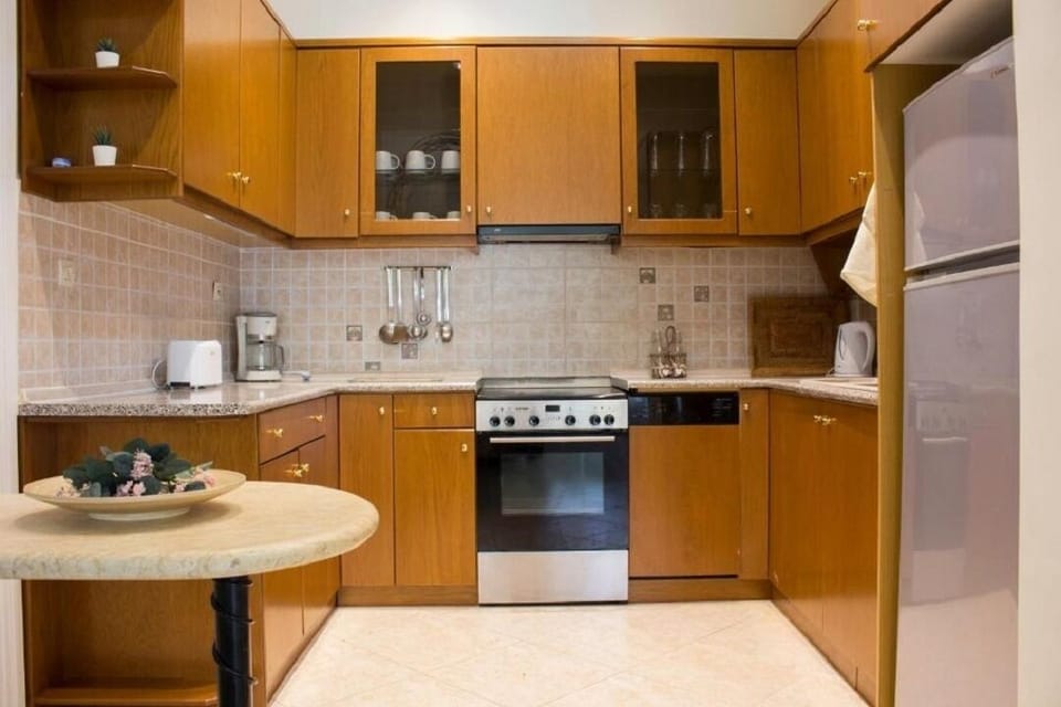 Kitchen in Physis rental estate