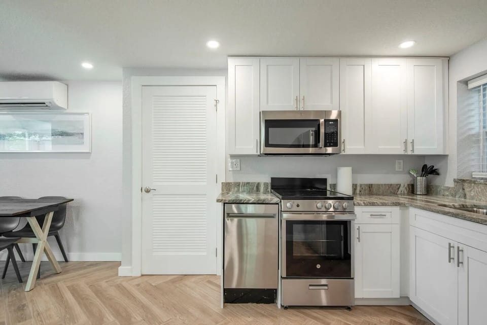 Full kitchen with appliances. 
