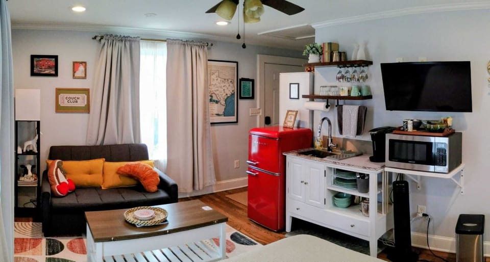  Seating area with convertible love seat and coffee table. 
