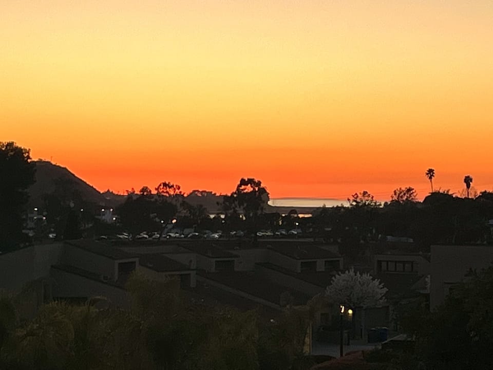 Ocean glimmering at twilight. View from the balcony.