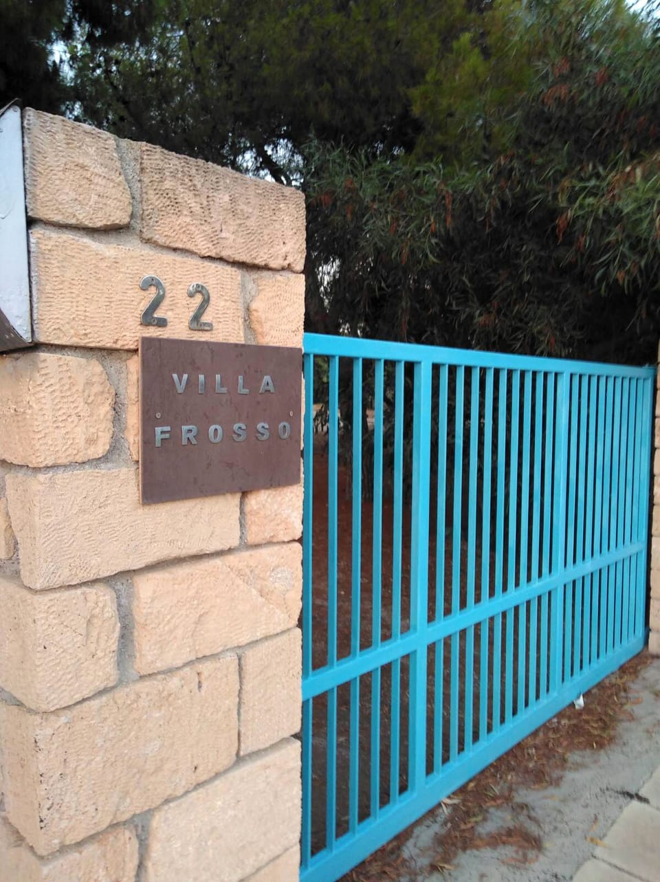 Blue gate at the front of the villa