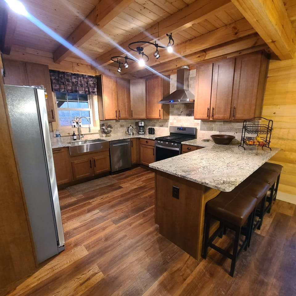 kitchen, coffee and or coffee maker, oven, refrigerator, stovetop