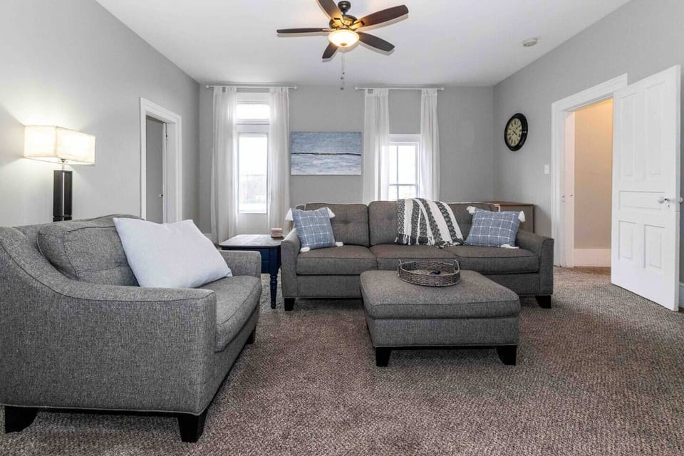 Cozy Living Room with new 55" TCL Roku Smart HDTV. Fast Wi-Fi throughout the space. There are two twin sized comfortable floor mattresses for extra sleeping, as well as the couch for up to 9 total.