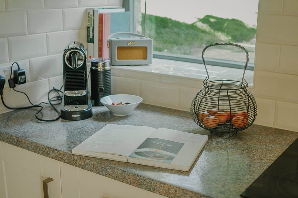 Ground floor: Open plan kitchen with oven, 4 ring hob, microwave, fridge/freezer & dishwasher