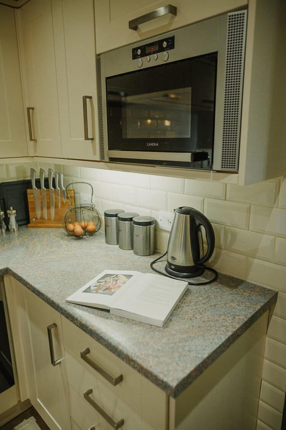 Ground floor: Open plan kitchen with oven, 4 ring hob, fridge, freezer, microwave & dishwasher