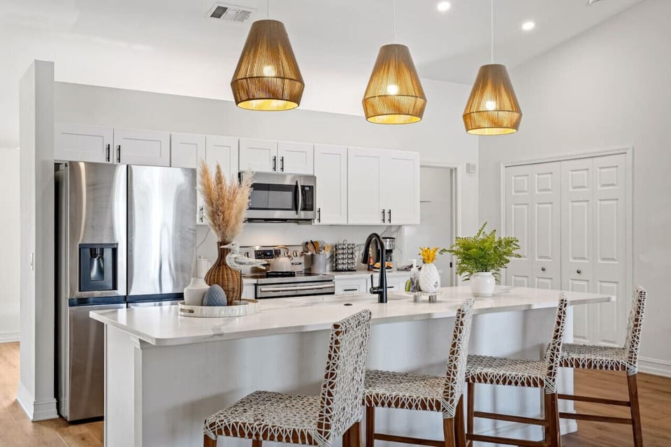 Pull up a chair and chat with the chef in this spacious modern kitchen