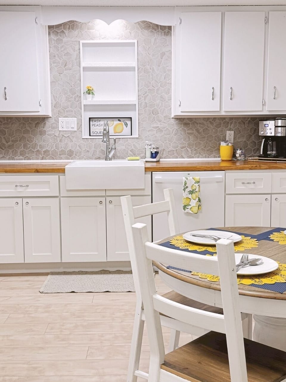 Gorgeous farmhouse sink and chrome faucet make the kitchen extra luxurious