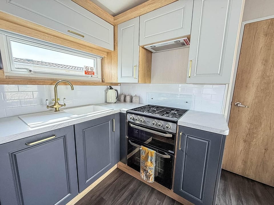 The kitchen effortlessly blends practicality with a welcoming atmosphere