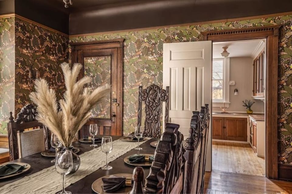 A beautifully styled central dining room featuring a large dining table