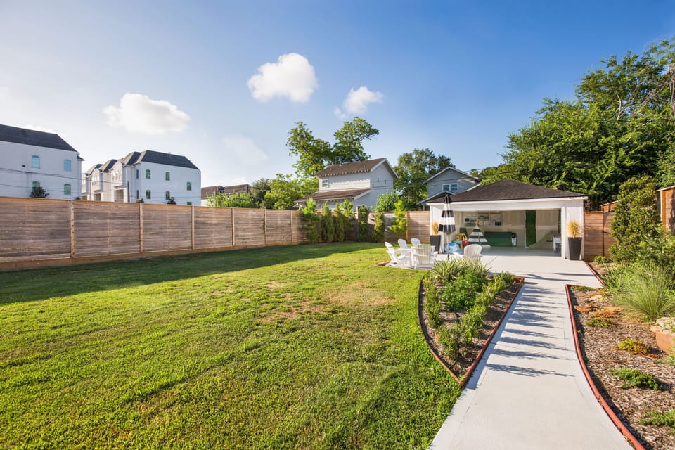 Huge backyard for kids and pets to roam! Double gated for safety with 8 ft fence