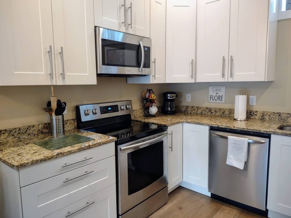 Fully Functional Kitchen with Granite Counter Tops and Stainless Steel Appliances